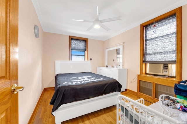 108-50 62nd Dr Unit 3F, Forest Hills, NY 11375 - bedroom with wood finished floors, crown molding, cooling unit, and a ceiling fan