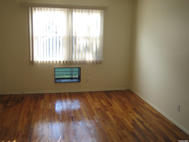 spare room featuring dark hardwood / wood-style floors