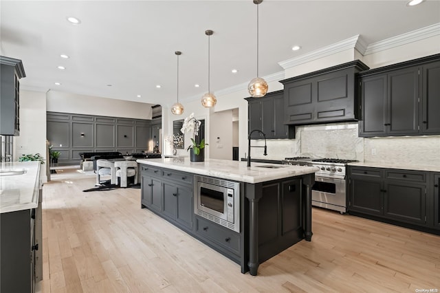 kitchen with stainless steel appliances, a sink, ornamental molding, backsplash, and light wood finished floors