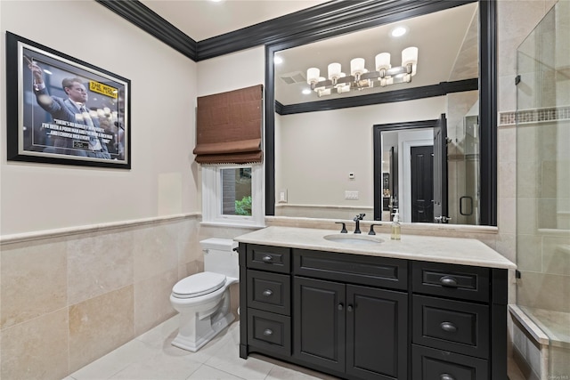 bathroom with a stall shower, toilet, tile patterned flooring, crown molding, and tile walls