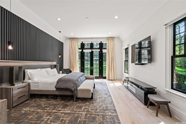 bedroom with baseboards, wood finished floors, access to outside, french doors, and recessed lighting