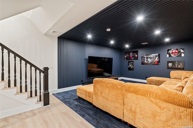 home theater room featuring baseboards, wood finished floors, visible vents, and recessed lighting