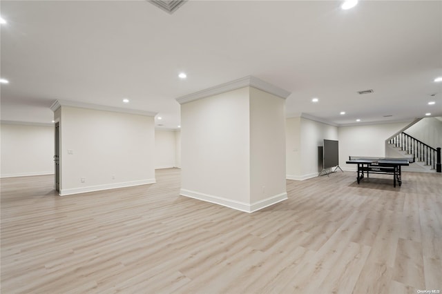 rec room featuring light wood-style floors, recessed lighting, and ornamental molding