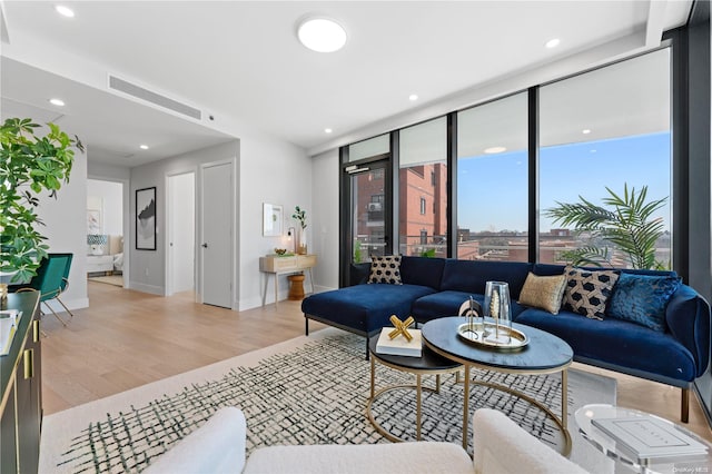 living room with light hardwood / wood-style floors