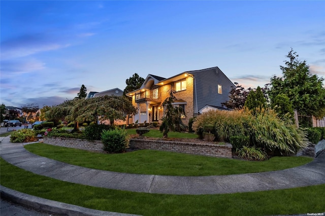 view of front of home featuring a yard