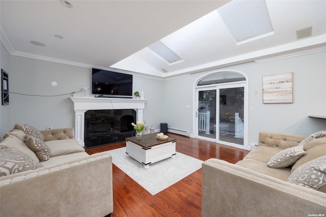 living room with baseboard heating, lofted ceiling, crown molding, and dark hardwood / wood-style floors