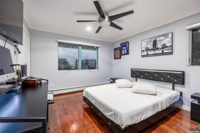 bedroom featuring ceiling fan, dark hardwood / wood-style flooring, ornamental molding, and a baseboard heating unit