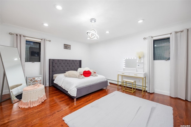 bedroom featuring dark hardwood / wood-style flooring, an inviting chandelier, a baseboard radiator, and ornamental molding