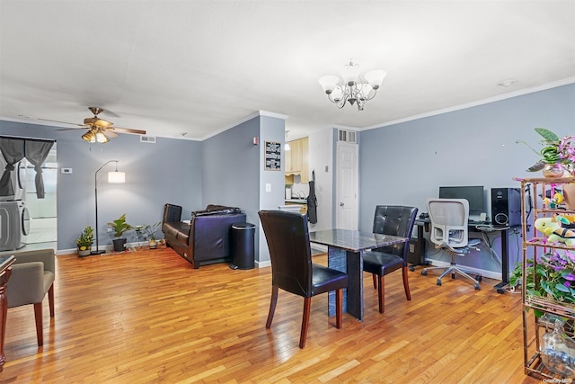 dining room featuring crown molding, light hardwood / wood-style flooring, and ceiling fan with notable chandelier