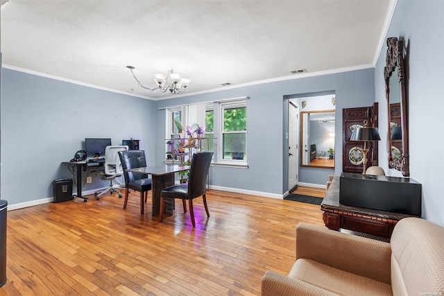 dining area with ornamental molding, light wood-type flooring, and a notable chandelier