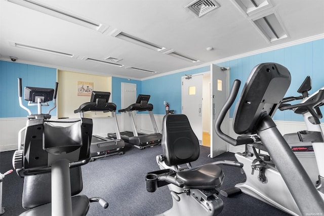 exercise room with ornamental molding