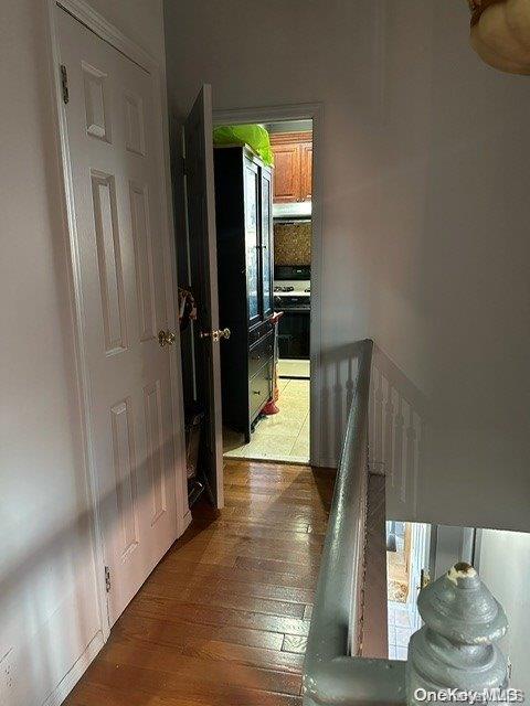 hallway featuring hardwood / wood-style flooring