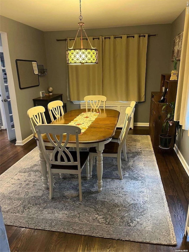 dining area with dark wood-type flooring