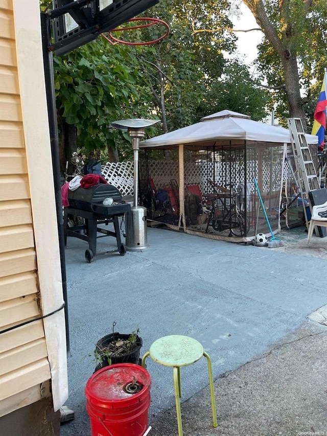 view of patio / terrace featuring a gazebo and grilling area