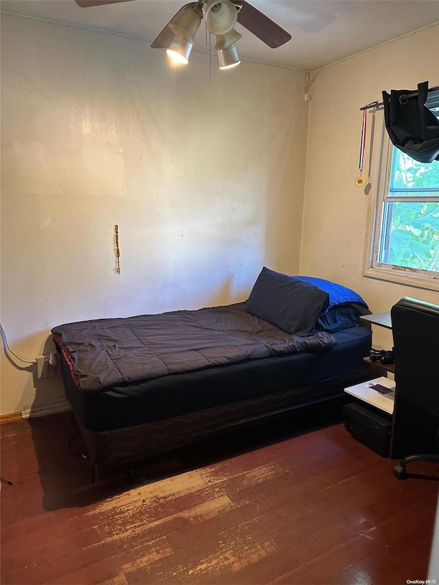 bedroom with wood-type flooring and ceiling fan