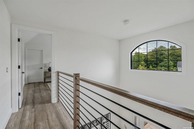 hall with hardwood / wood-style flooring