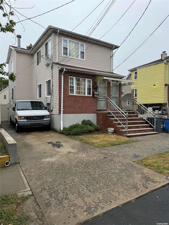 view of front of house with cooling unit