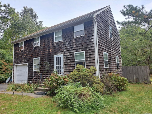 view of front of home featuring a garage and a front yard