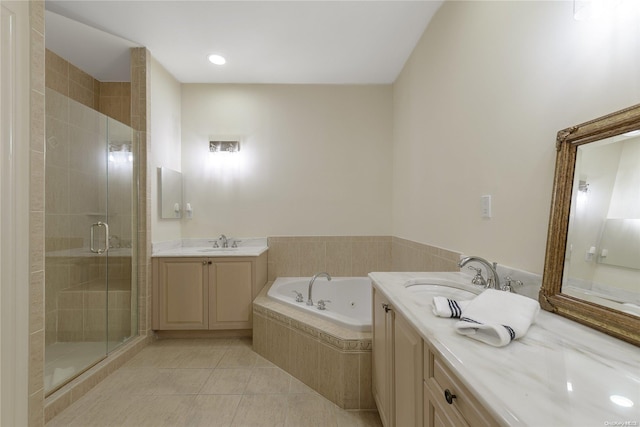 bathroom with tile patterned flooring, vanity, and independent shower and bath