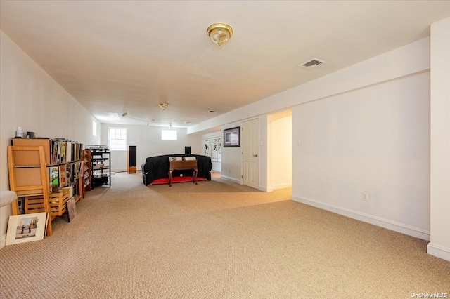 sitting room featuring carpet flooring