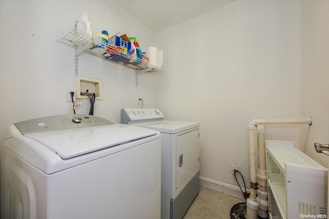 laundry area with independent washer and dryer