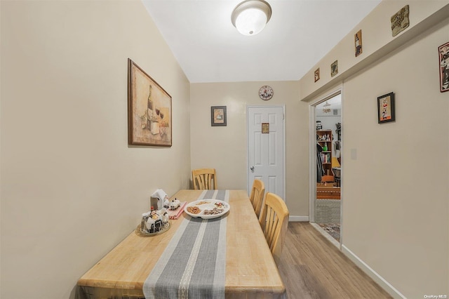 dining area with light hardwood / wood-style floors