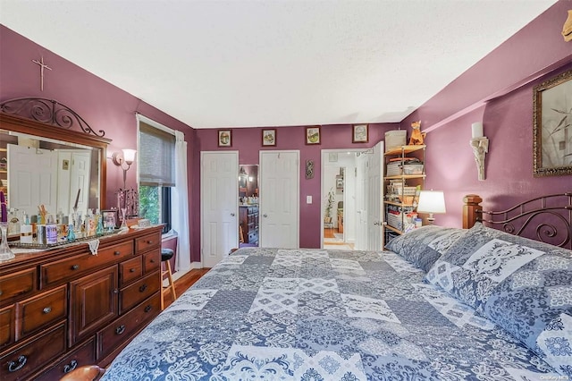 bedroom with wood-type flooring