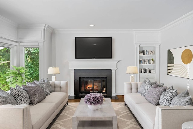 living room with hardwood / wood-style flooring and ornamental molding