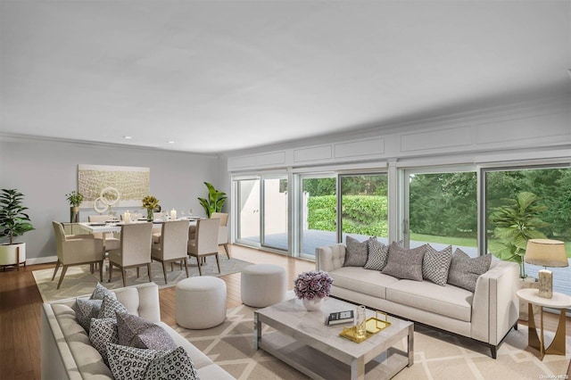 living room with crown molding and light hardwood / wood-style floors