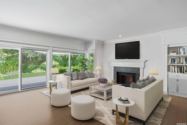 living room featuring ornamental molding and hardwood / wood-style floors