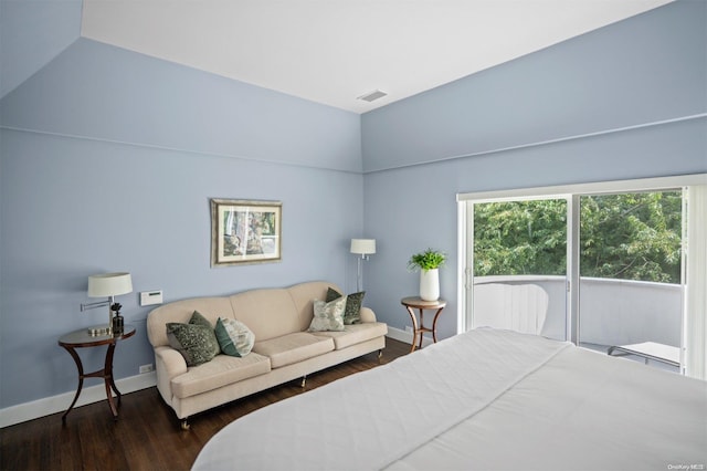 bedroom featuring vaulted ceiling and dark hardwood / wood-style flooring