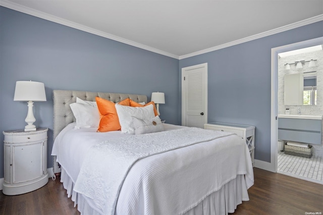 bedroom with connected bathroom, ornamental molding, and dark hardwood / wood-style floors