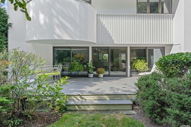 rear view of house with a wooden deck