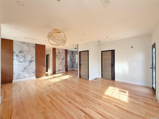 spare room with light hardwood / wood-style flooring