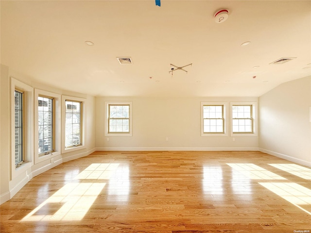 spare room featuring light wood-type flooring