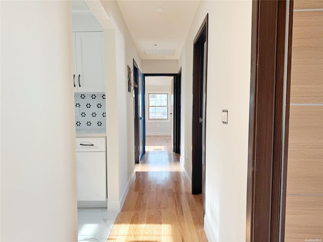 corridor featuring light hardwood / wood-style flooring