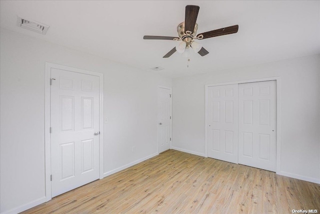 unfurnished bedroom with light hardwood / wood-style floors and ceiling fan