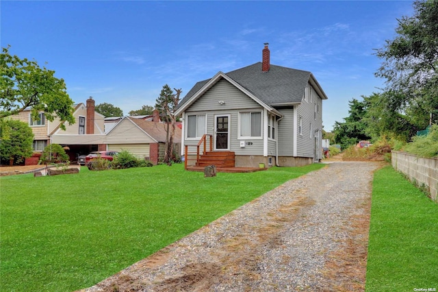 bungalow-style home featuring a front yard