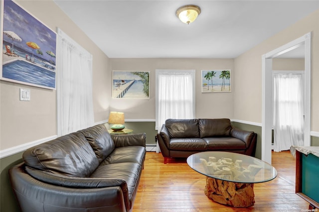 living room with hardwood / wood-style floors and baseboard heating