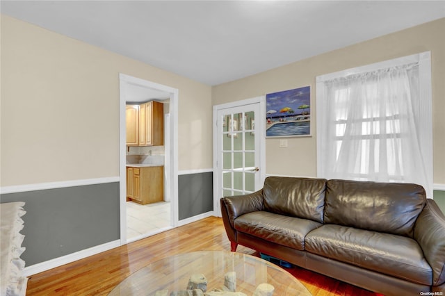 living room with light hardwood / wood-style flooring and a wealth of natural light