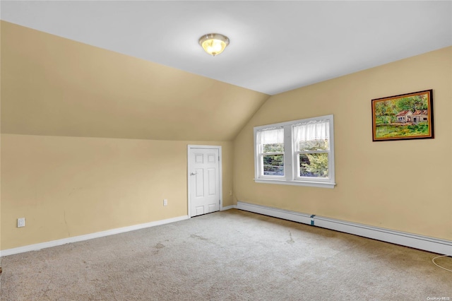 bonus room featuring carpet flooring, vaulted ceiling, and a baseboard heating unit