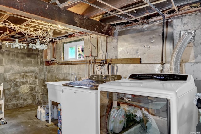 laundry room with washing machine and dryer and sink