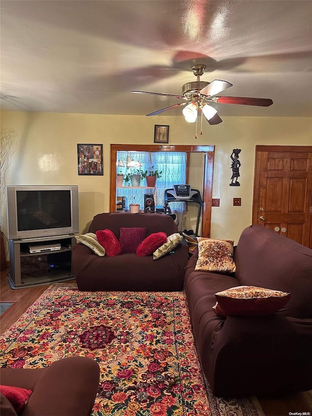 living room with ceiling fan and wood-type flooring