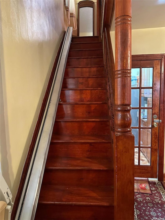 staircase featuring plenty of natural light