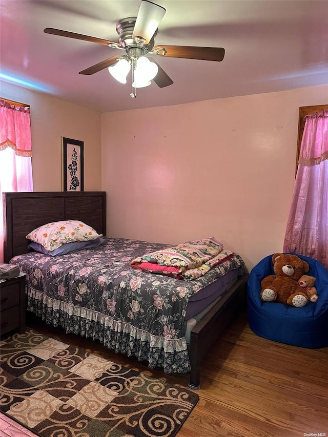 bedroom featuring hardwood / wood-style flooring and ceiling fan