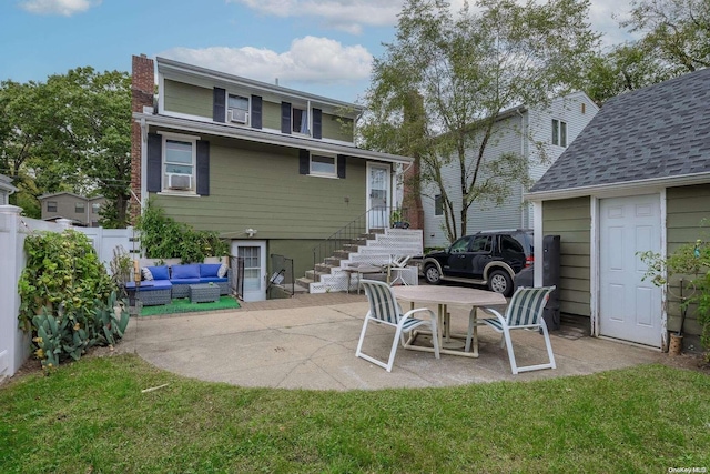 back of house with outdoor lounge area, a yard, a patio, and cooling unit