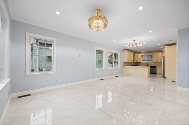 unfurnished living room featuring crown molding and an inviting chandelier