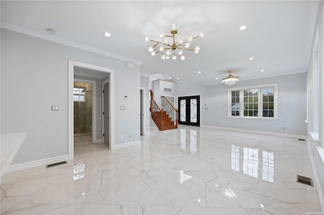 empty room featuring ornamental molding, french doors, and an inviting chandelier