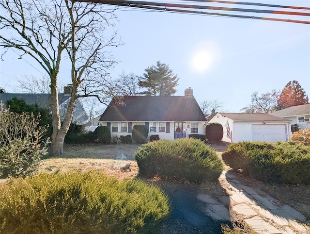 view of front of property with an outbuilding and a garage