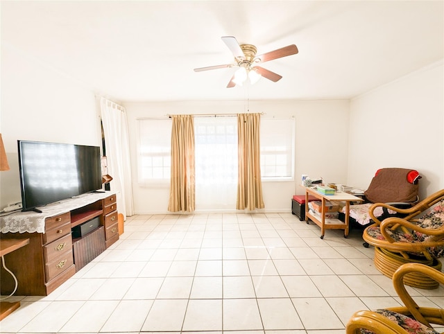 living area featuring light tile patterned floors and ceiling fan